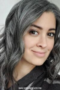 image of a beautiful young woman with salt and pepper wavy hair