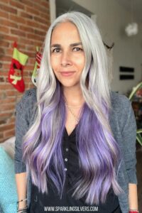 image of a woman with silver hair and purple underneath