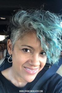 image of a woman with grey hair and teal color
