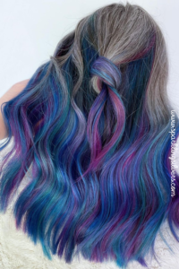 image of long salt and pepper hair with pink and blue highlights