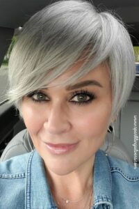 A woman with side swept pixie haircut