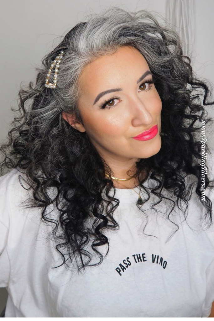 Hair curls style with a hair pin on grey hair