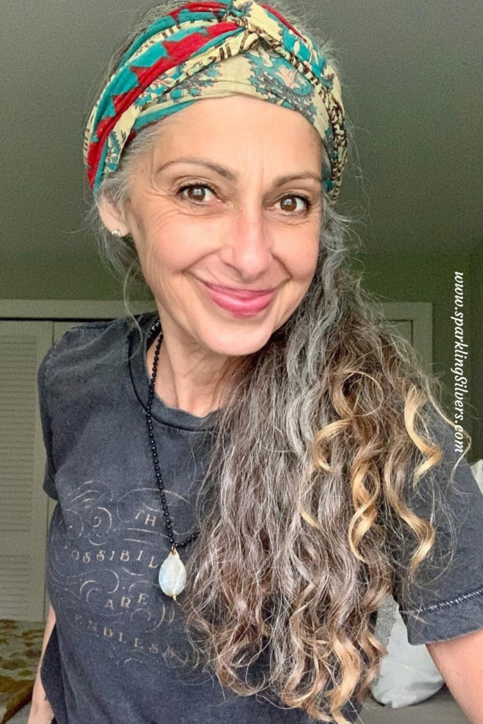 Long gray haired lady with a bandana