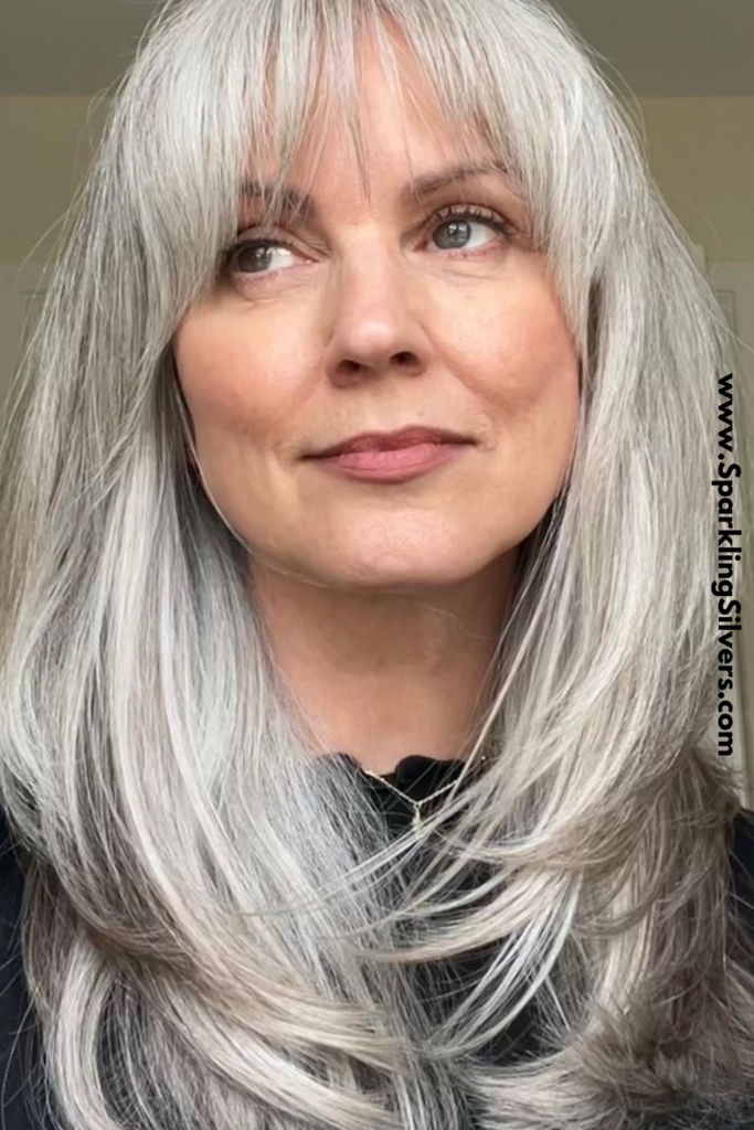 layered long gray hair over 50